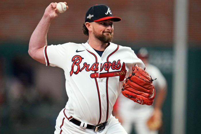 Oct 9, 2023; Cumberland, Georgia, USA; Atlanta Braves relief pitcher Kirby Yates (22) pitches during the fifth inning against the Philadelphia Phillies in game two of the NLDS for the 2023 MLB playoffs at Truist Park.